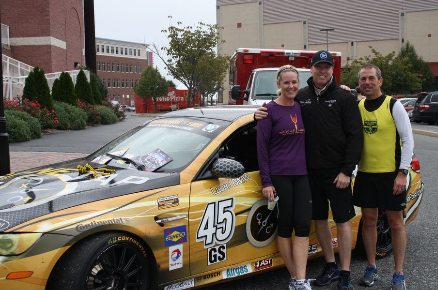 Race car driver & 5K sponsor Al Carter stands between Trish & Rich Szymanski